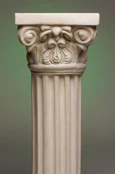 Ancient Column Pillar Replica on a Green Gradation Background.