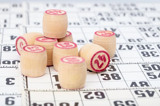 Chips to play Lotto, against a background of playing cards