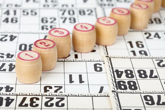 Kegs for bingo on white cards background