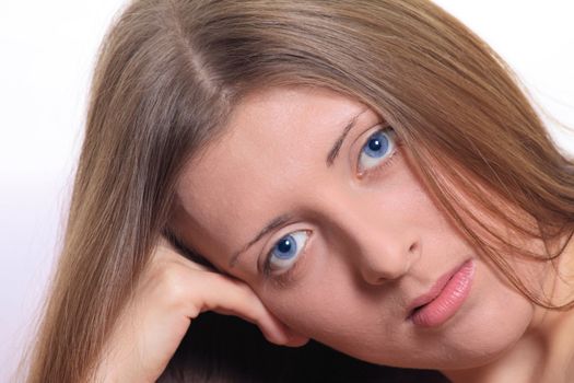 Portrait of the nice blue-eyed girl close up