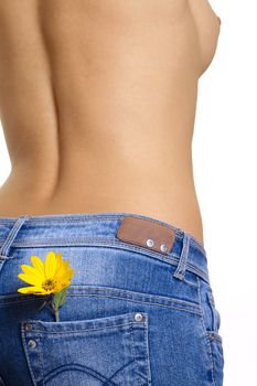 Nude girl with blue jeans and yellow flower