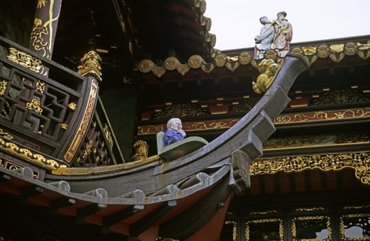 Detail of a Chinese man in a boat on the Chinese Pavillion in Brussels, Belgium.