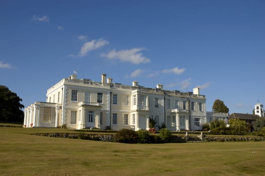 A large white house in the countryside