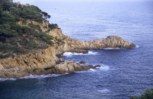 The Mediterranean sea carves jagged cliffs from Spain's Costa Brava.