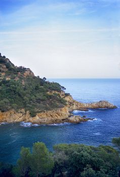 The Mediterranean sea carves jagged cliffs from Spain's Costa Brava.