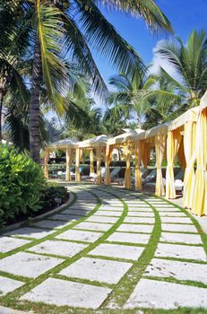 A row of brightly coloured cabanas await tourists seeking rest and relaxation on Great Exuma Island in the Bahamas. 