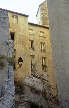 A group of houses emerging from the rock in Avignon, France.