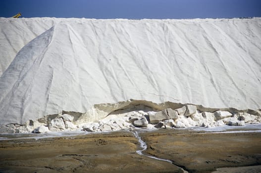 Mountain of salt piled and drying in the sun, salt flats, Salin de Giraud, Camargue, France.
