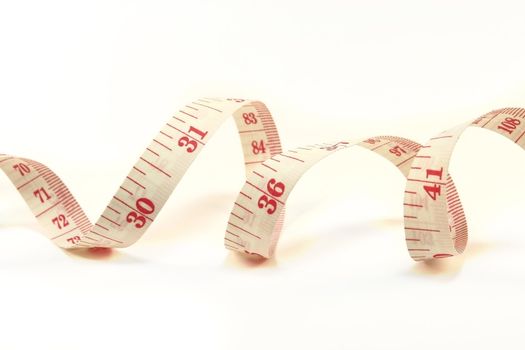 Tape measure curled isolated on a white background
