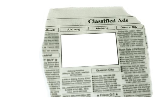 looking for something in newspaper  note blurred all copyrights material
