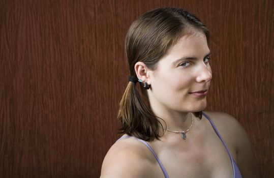 Closeup of woman with blue eyes wearing pigtails