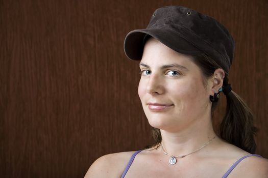 Closeup of woman with blue eyes wearing a cap