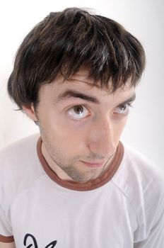 Surprised young man on white background