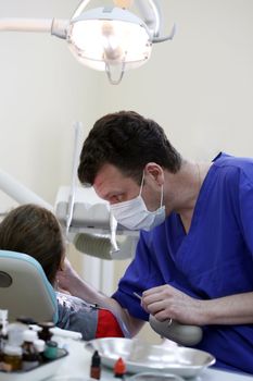 Patient and doctor in stomatological office