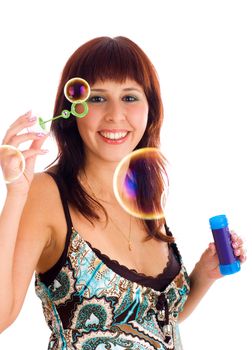 Young smiling brunette woman with soap bubbles