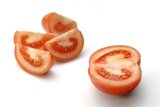 Cut sunny tomato on white (with path)