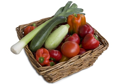 Wicker basket full of fresh, colorful and tasty vegetables