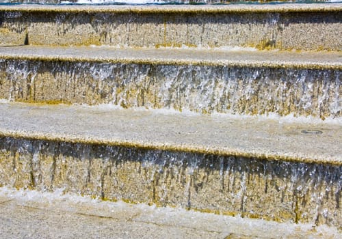 The image of a cascade fountain - steps on which runs water.