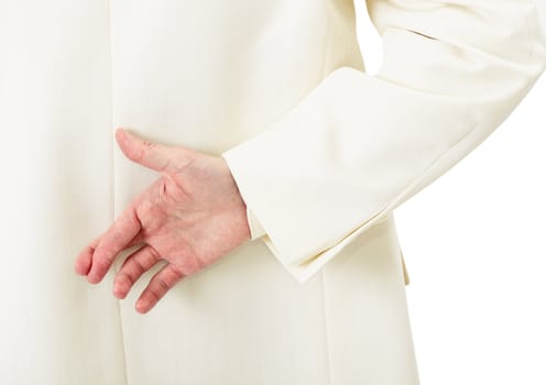 Businessman in white suit with crossed fingers behind his back