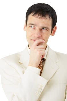 A man in a business suit intently thinking