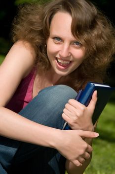 Happy student with notebook.