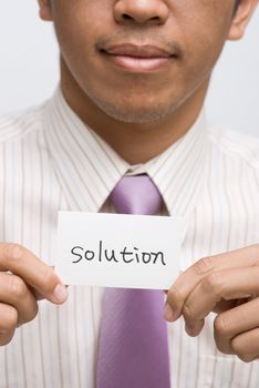 Business man find one solution card and holding.
