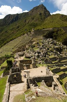 Machu Picchu  is a pre-Columbian Inca site located 2,400 meters (7,875 ft) above sea level. It is situated on a mountain ridge above the Urubamba Valley in Peru, which is 80 km (50 mi) northwest of Cusco. Often referred to as "The Lost City of the Incas", Machu Picchu is probably the most familiar symbol of the Inca Empire.