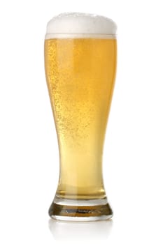 Glass of cold and fresh golden beer, over white background