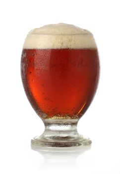 Cold glass of beer over white background