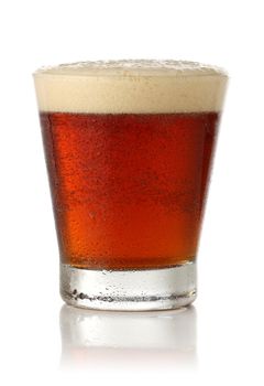 Cold glass of beer over white background