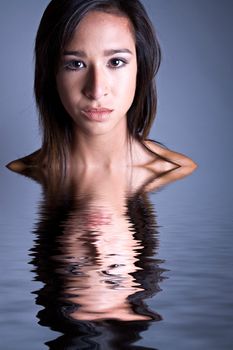 Studio portrait of a beautiful mixed race, vietnamese girl in a classical way