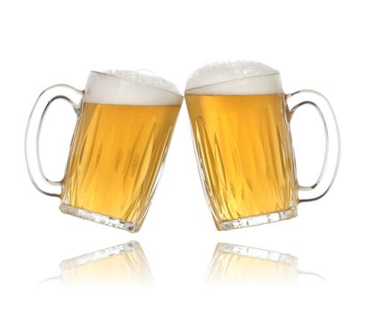 Pair of beer glasses making a toast. Beer splash