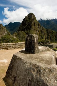 Machu Picchu  is a pre-Columbian Inca site located 2,400 meters (7,875 ft) above sea level. It is situated on a mountain ridge above the Urubamba Valley in Peru, which is 80 km (50 mi) northwest of Cusco. Often referred to as "The Lost City of the Incas", Machu Picchu is probably the most familiar symbol of the Inca Empire.