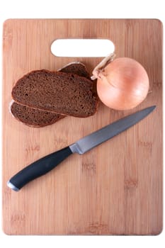 Two slices of black bread, bulb and knife on a finishing kitchen board. Products are placed so that the designer could make an inscription.