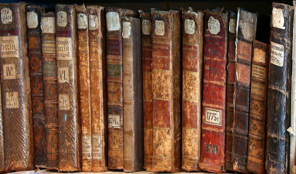 Row of old  books cover spines