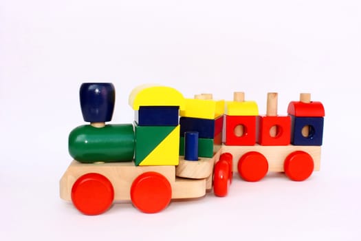 A colorful wooden train toy for children, isolated