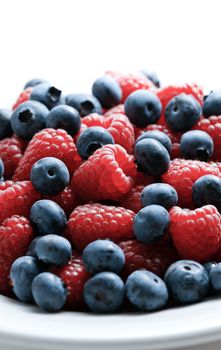 Close up of mixed berries in a bowl - shot in studio