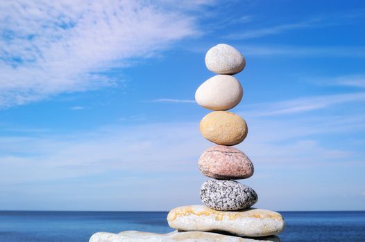 Pebbles of round shape put together on each other in the equilibrium