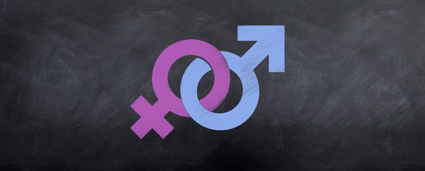 Male and Female symbols interlock in color on the blackboard