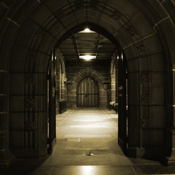 Looking through arched doors in ancient building