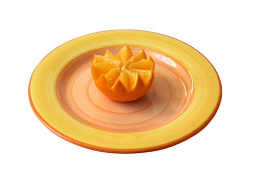 orange on the colorful saucer isolated on white background