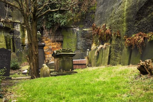 Row of very old tombstones in a cemetery