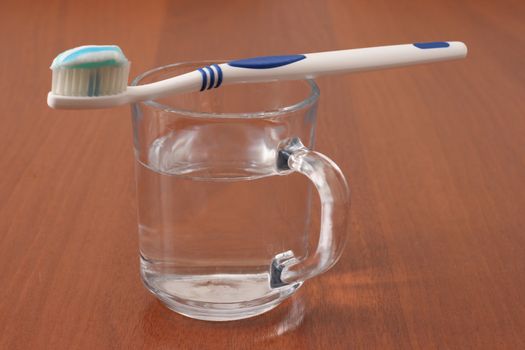 toothbrush and a glass of water