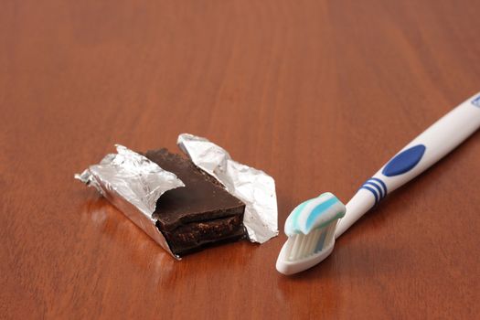 tooth brush next to chocolate