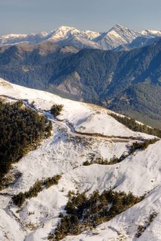 Landscape of snow mountain and road in winter.