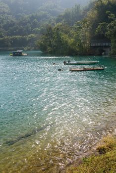 Lake scenic of sunny day with forest .
