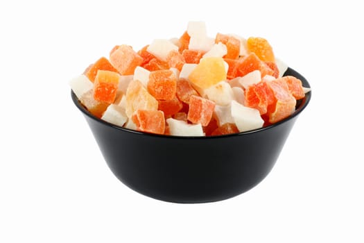 Black bowl full of dried papaya and coconut