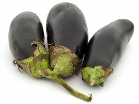 Three big eggplants on a white background.