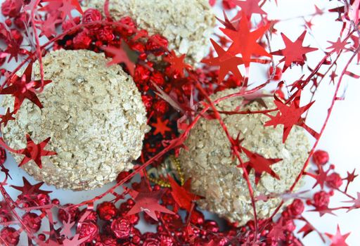 christmas decorations, shiny gold sphere and red garland