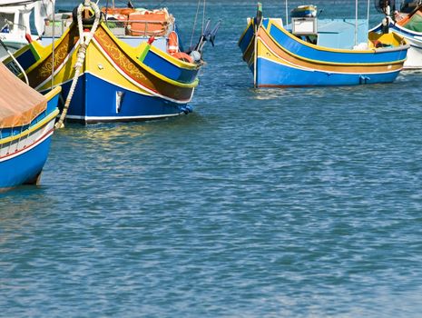 Traditional fishing boats of Malta in the fishing village of Marsaxlokk